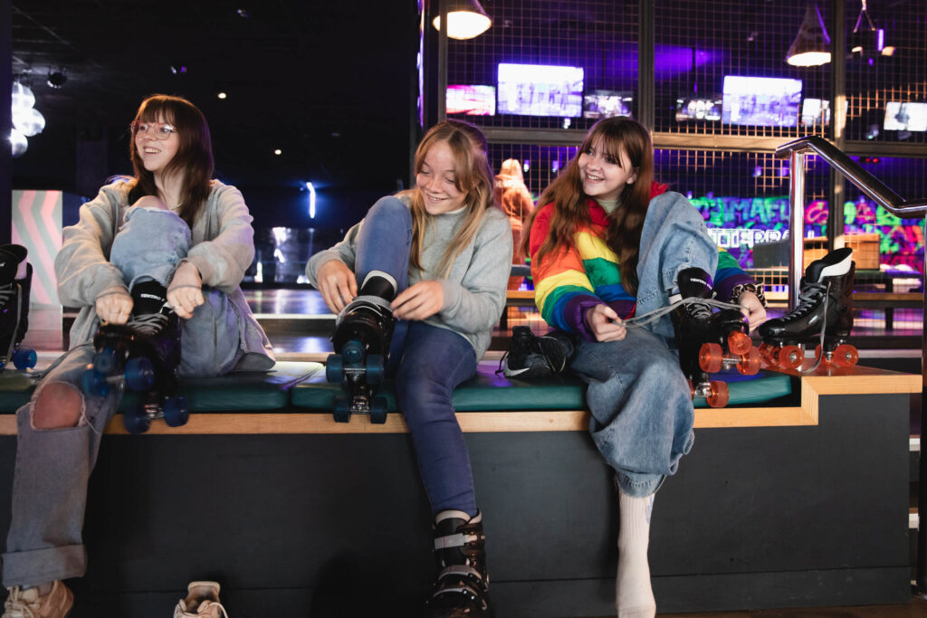 Children getting ready with roller skates at Gutterball North Shields